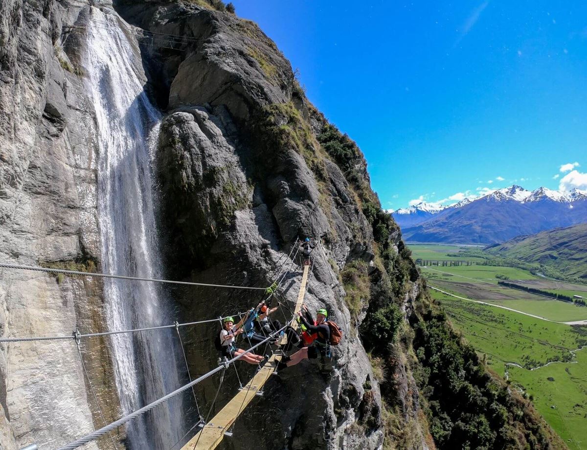 Group of five on world’s highest waterfall cable climb with Wildwire in Wanaka.