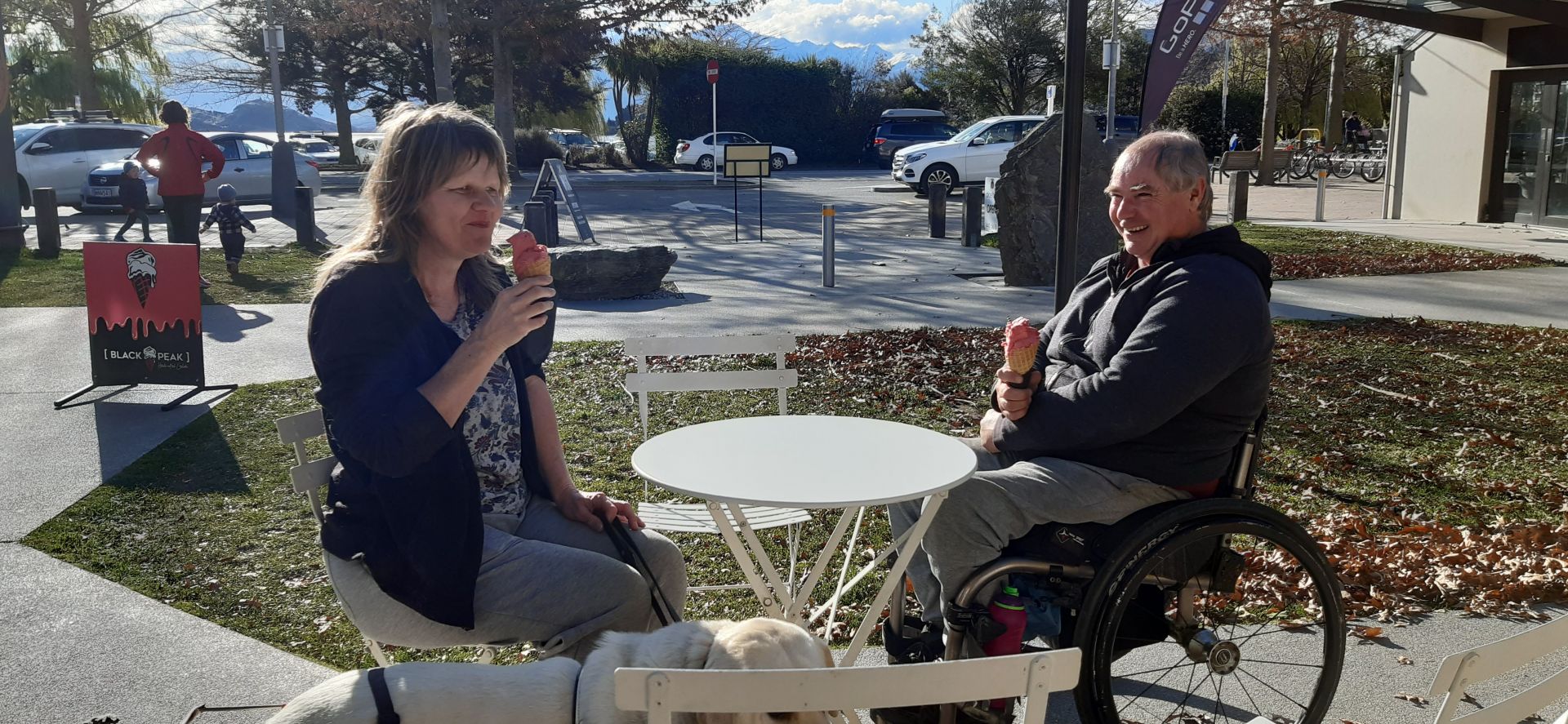 Two people out in town enjoying ice cream at Black Peak in Wanaka.