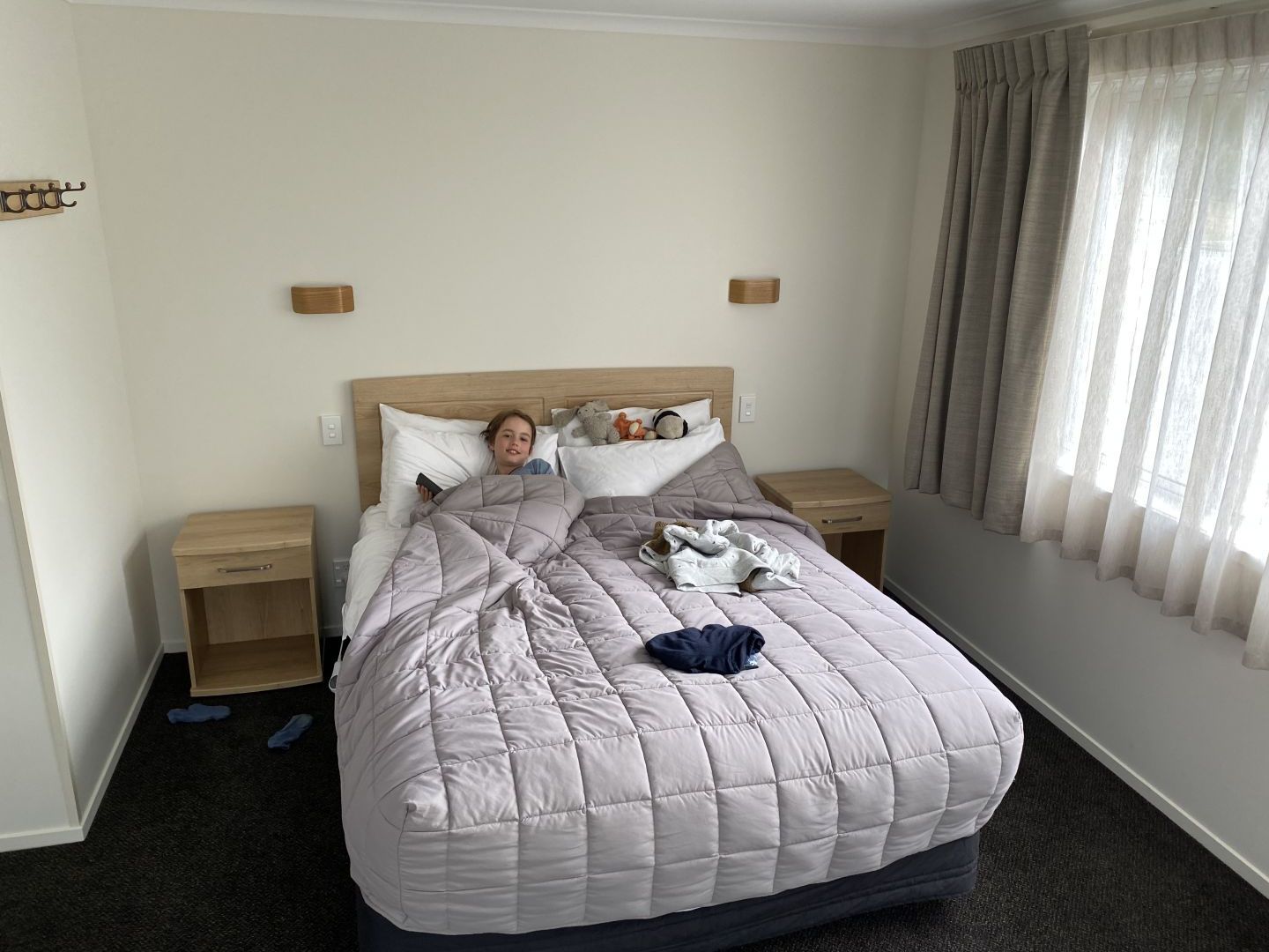 Child in bed while staying at Wanaka Top 10 Holiday Park.